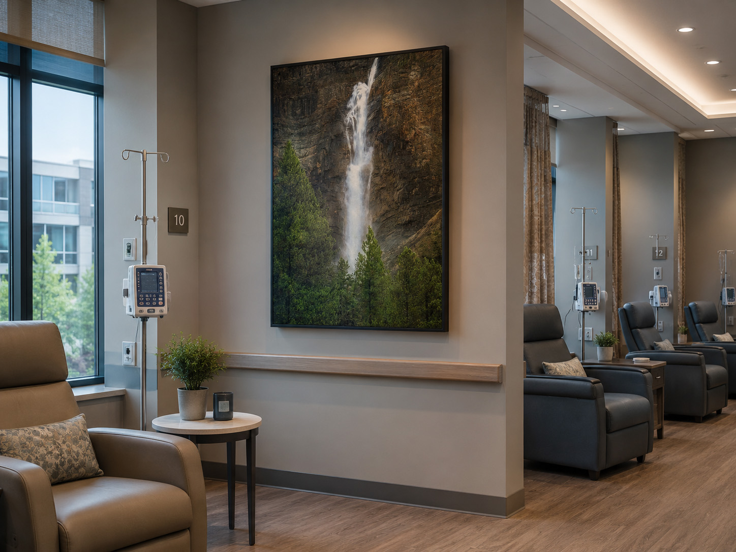 Healthcare infusion room with calming waterfall artwork by Dan Sproul